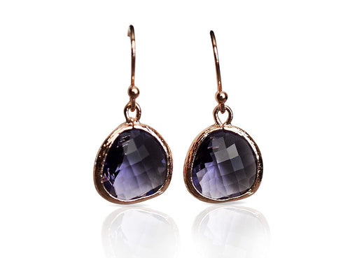 Pair of purple teardrop earrings with rose gold frames on a white background