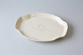 Ivory colored, handmade ceramic dish with 'APD' and Mother of the Bride with wedding date on a gray background