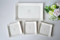 Set of white ceramic dishes personalized with couple's monogram and wedding date